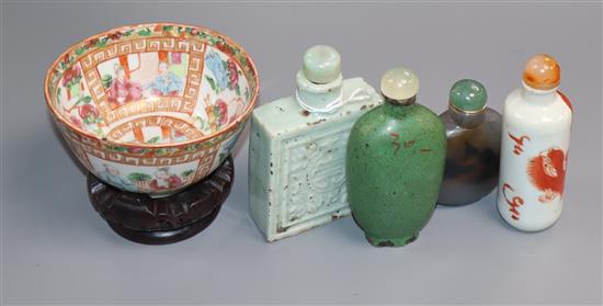 Four 19th century Chinese snuff bottles and a Canton famille rose bowl, wood stand